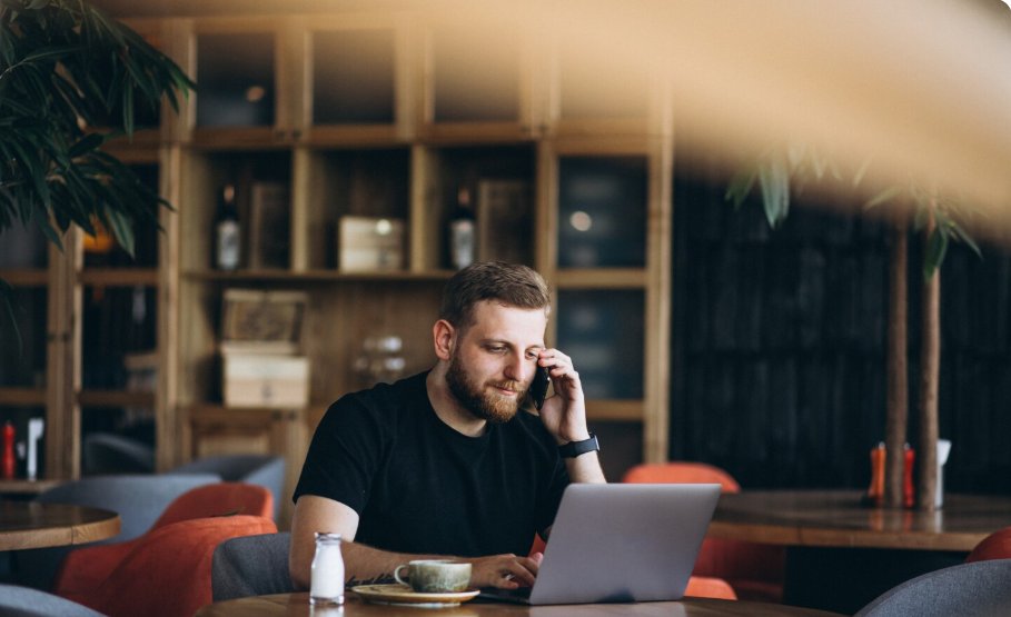 Laptop and coffee on a cafe table for remote work